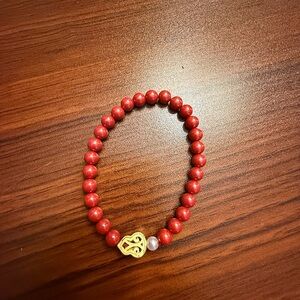 Elegant Red Beaded Bracelet with Gold Accent